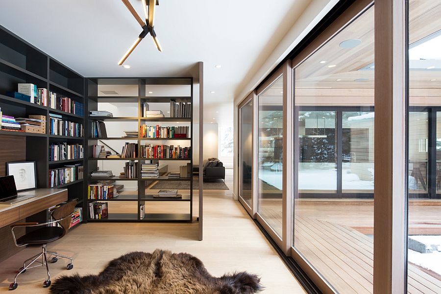 Open bookshelf adds as  a divider between the home office and living room