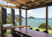 Outdoor-dining-space-under-pergola-with-stunning-sea-views-in-New-Zealand-217x155