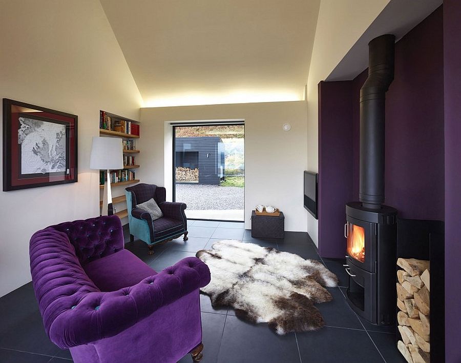 Plush purple sofa adds to the opulence of the interior