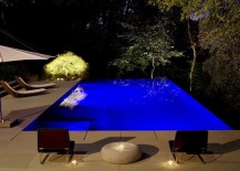 Relaxing-backyard-with-LED-pool-lighting-and-an-illuminated-tree-217x155