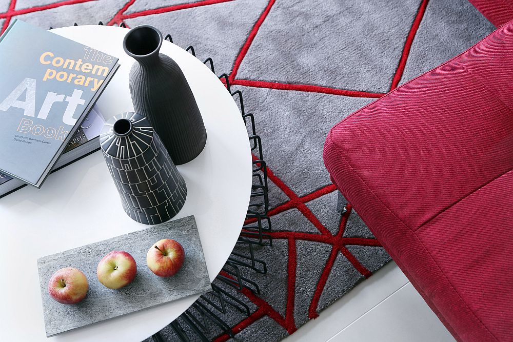 Rug in gray and red complements the color scheme of the living room