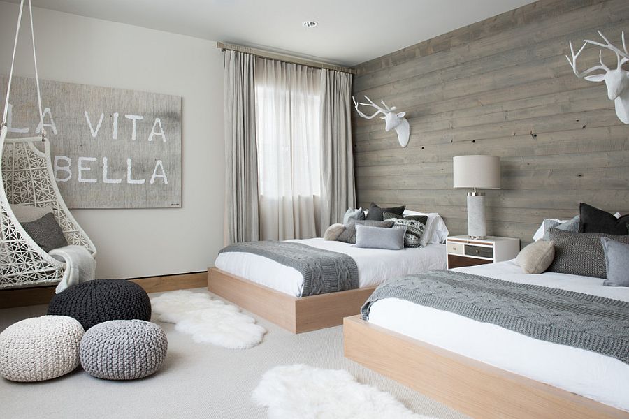 Scandinavian bedroom with wooden accent wall and pops of gray [Design: Reed Design Group]