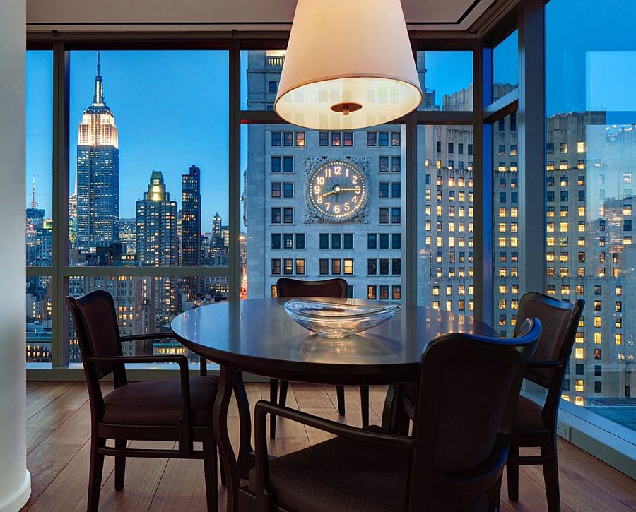 Small dining space in the corner with New York City's sparkling skyline as backdrop