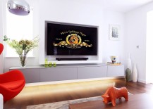 Smart-Tv-room-design-with-ample-ventilation-plush-setaing-and-65-inch-LED-TV-217x155