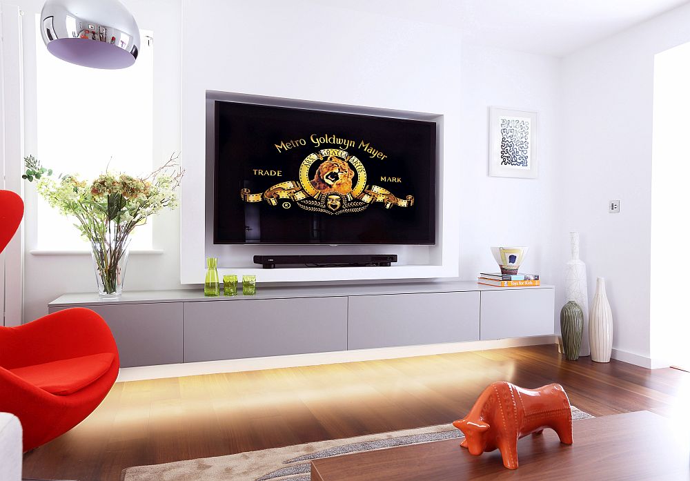 Smart Tv room design with ample ventilation, plush setaing and 65-inch LED TV