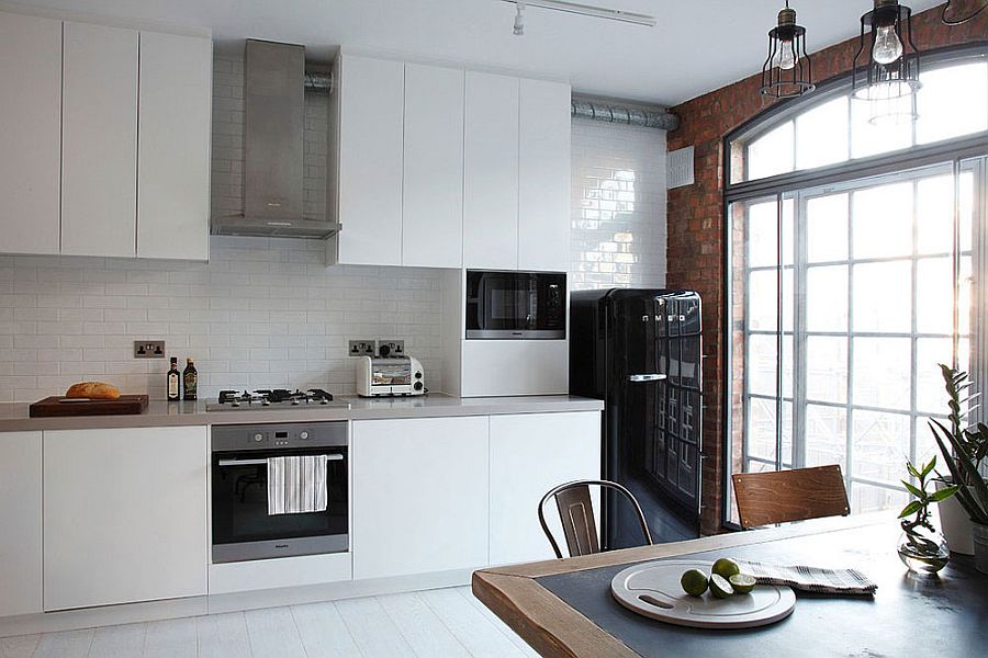 Smart white kitchen with tiled backsplash