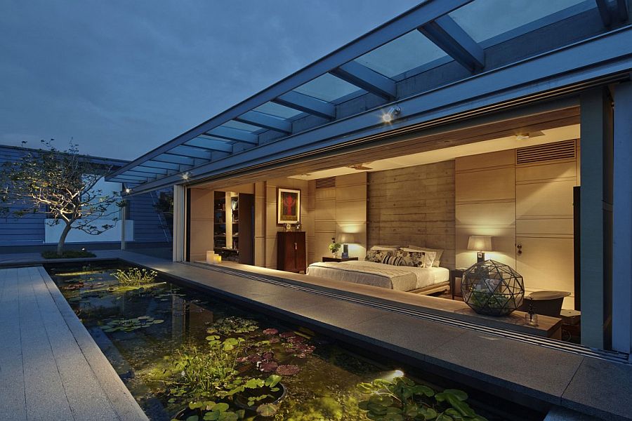 Lily pond and brass terrarium add serenity to a Singapore home