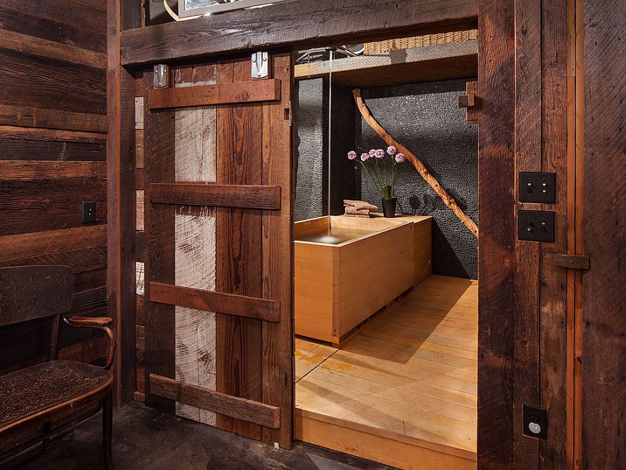 Stunning bathroom with sliding barn door and Japanese soaking tub