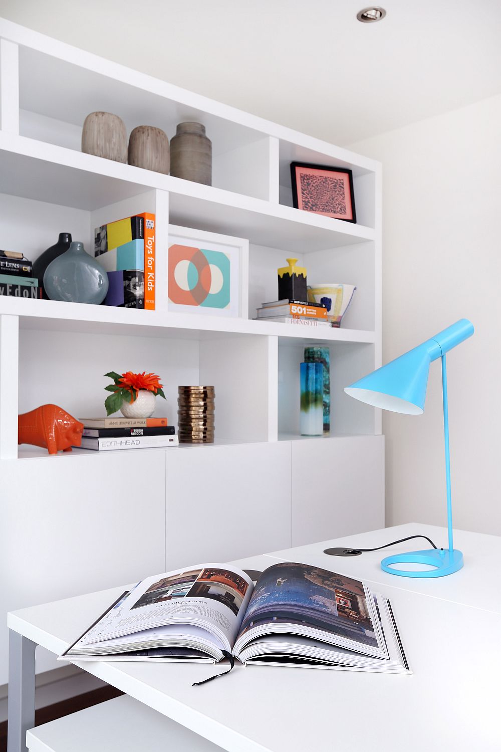 Turquoise Arne Jacobsen AJ table lamp on the work table