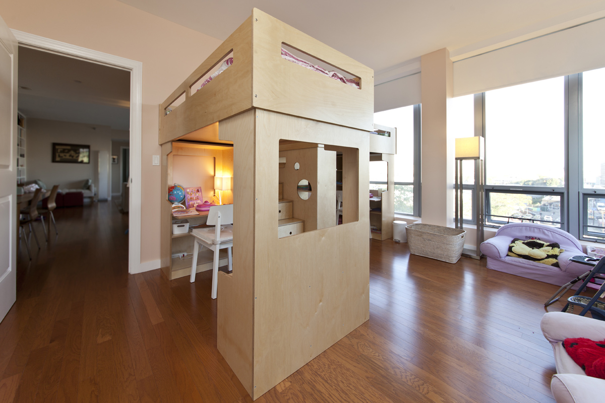 Two Dumbo loft beds share storage stairs with a view