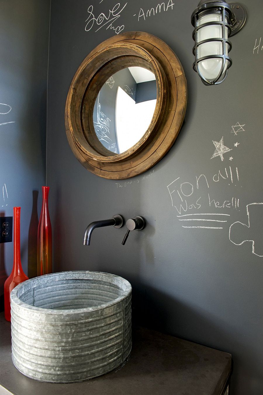 Unique mirror and chalkboard wall in the small bathroom