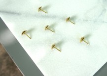 Upholstery-nails-on-a-marble-tile-217x155
