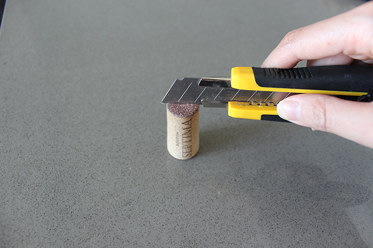 Use a blade to cut into your wine cork