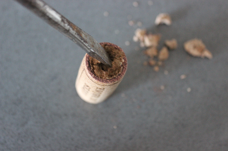 Use screwdriver to hollow out wine cork