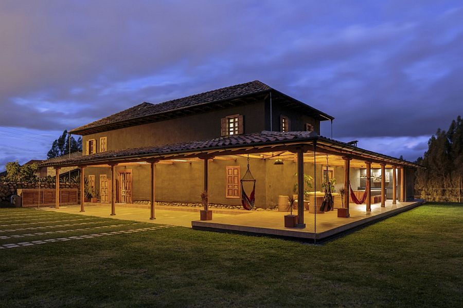 Warm lighting adds to the aura of the modern rustic home in Ecuador