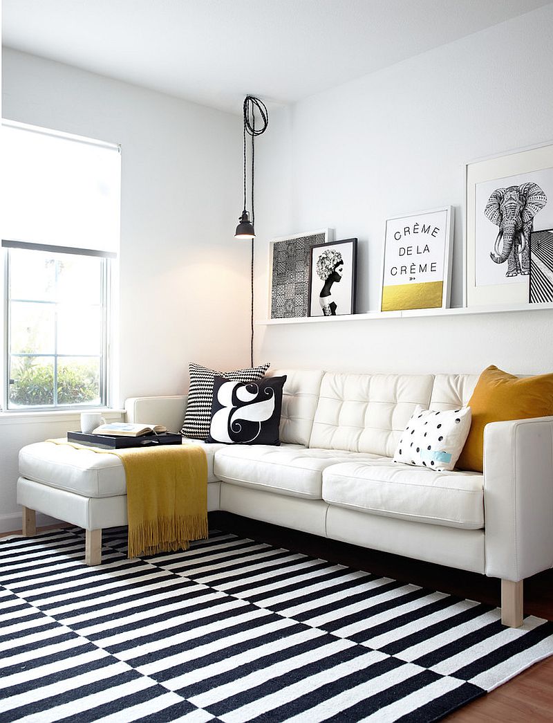 Black and white living room with elegant pops of yellow