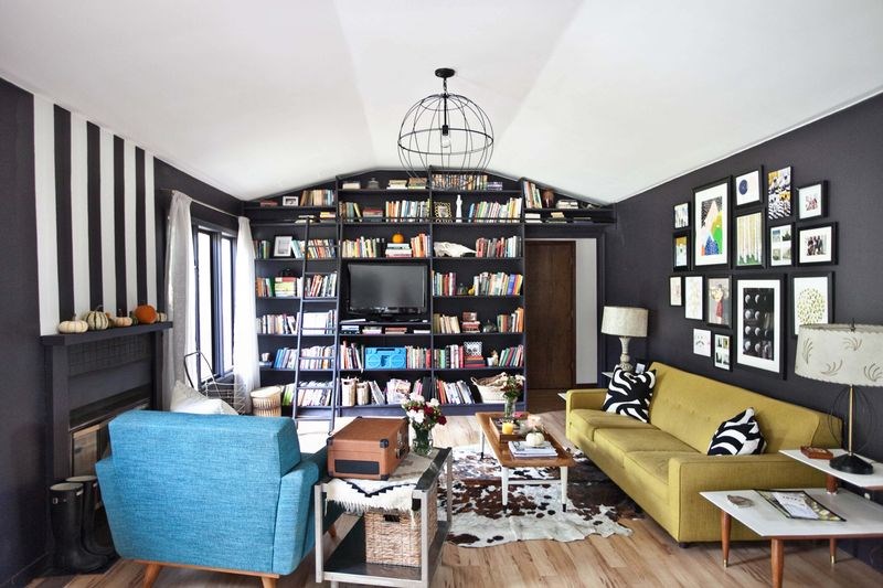 Black living room featuring painted stripes