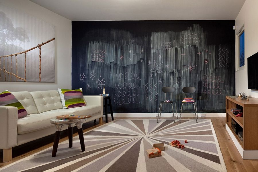 Chalkboard wall becomes the focal point in this lovely family space