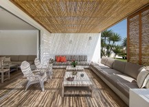 Comfy-outdoor-lounge-area-with-bamboo-blinds-and-plush-seating-217x155