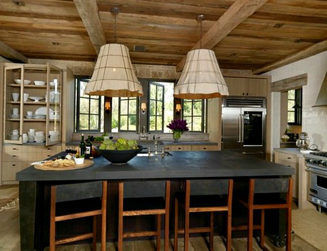 Dark kitchen island adds elegance to the rustic kitchen