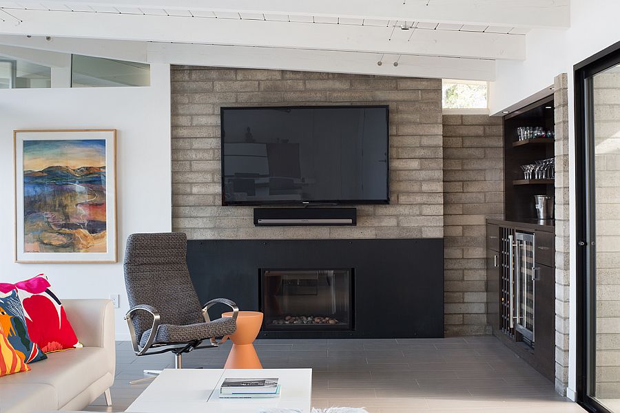 Concrete fireplace block brings  ahint of Midcentury charm to the interior