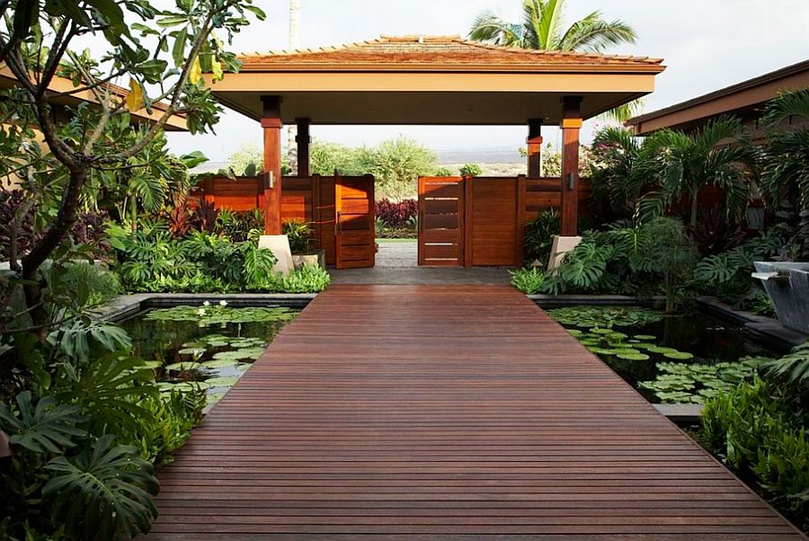 Create a stunning entrance with serene pond and a stunning walkway [Design: Willman Interiors / Gina Willman]