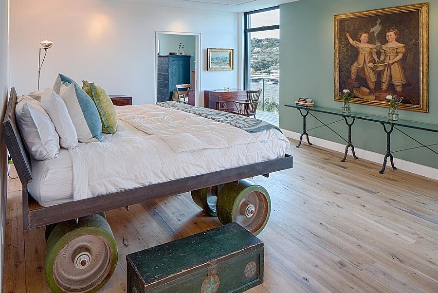 Custom bed on giant wheels steals the show in this eclectic bedroom