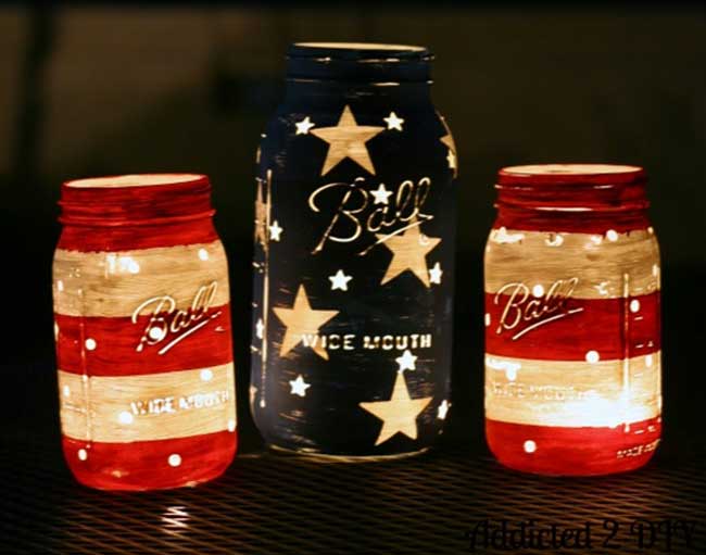 DIY Painted Red White and Blue Mason Jars Lit Up at Night