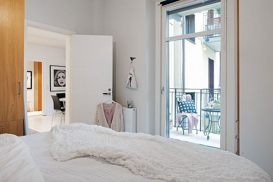 Elegant bedroom with a small balcony and minimalist design