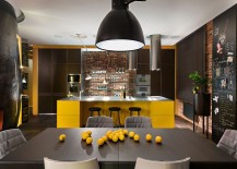 Elegant-use-of-yellow-and-black-in-the-kitchen-along-with-a-brick-wall-217x155