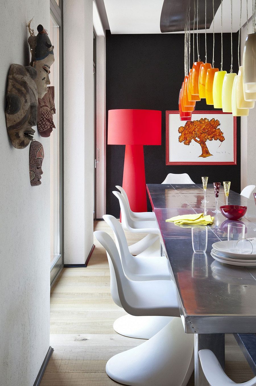 Exquisite use of large floor lamp and pendants in the stunning dining room