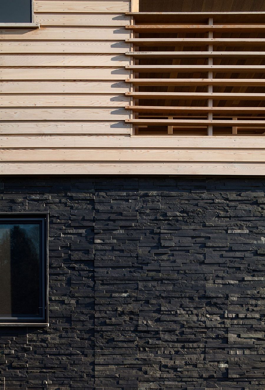 Exterior of the gorgeous weekend home draped in cedar and slate