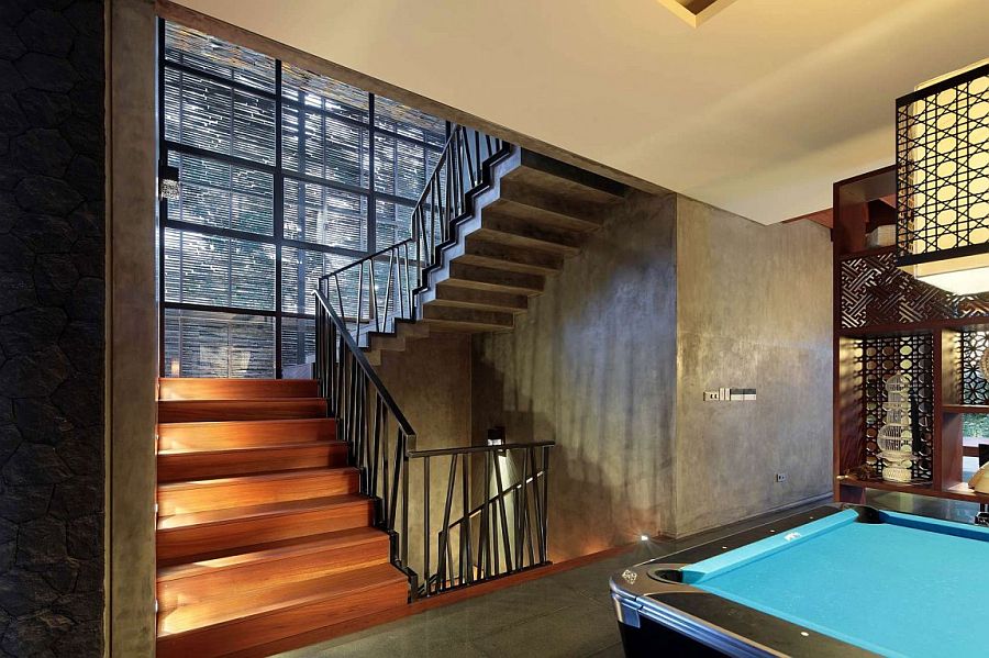 Family room with pool table next to the living room