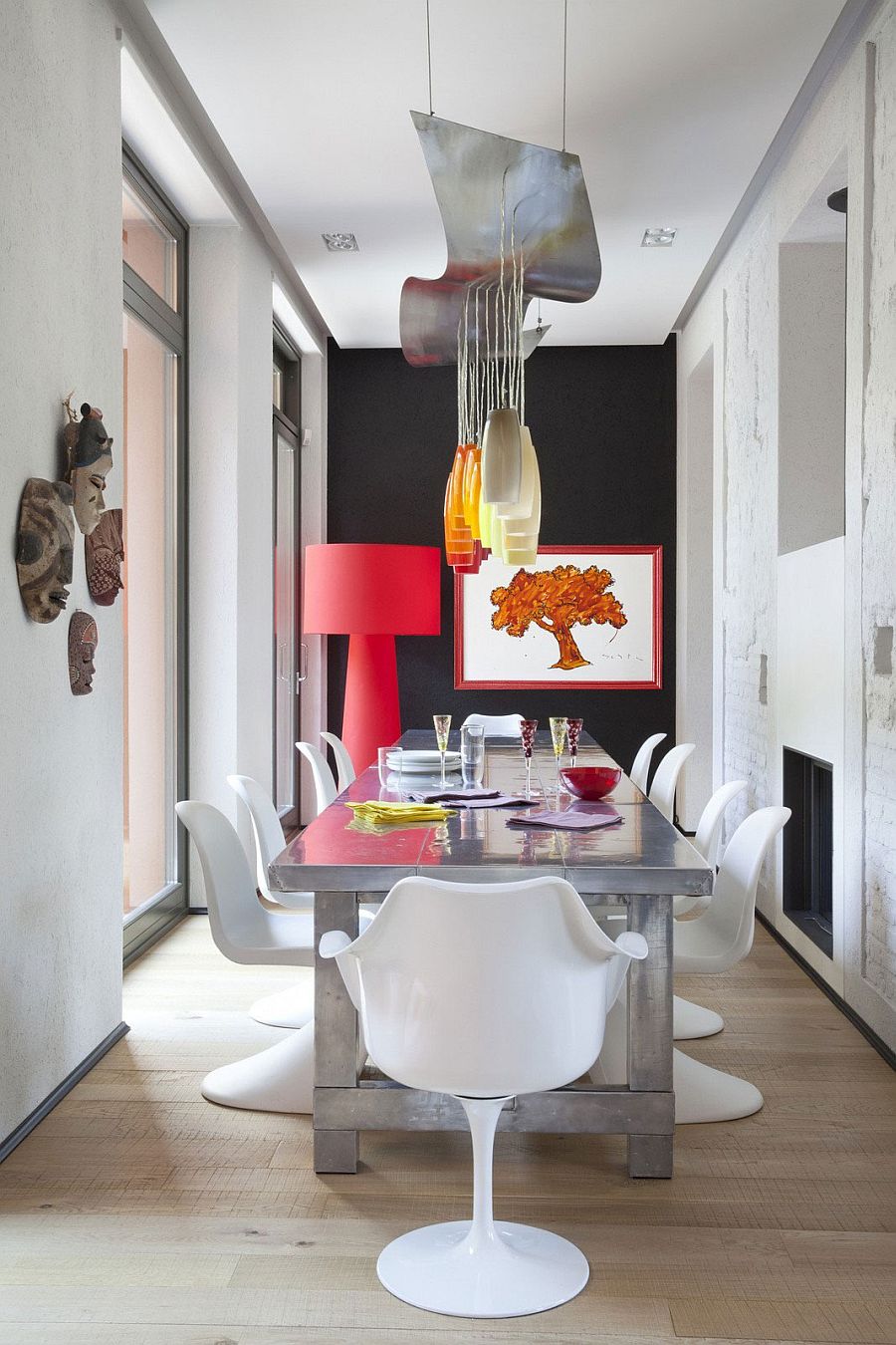 Formal dining area gets a colorful, fun twist inside this eclectic Italian home