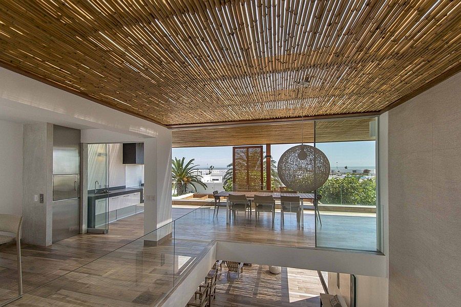 Glass creates a lovely indoor-outdoor inteplay inside the chic Peru home