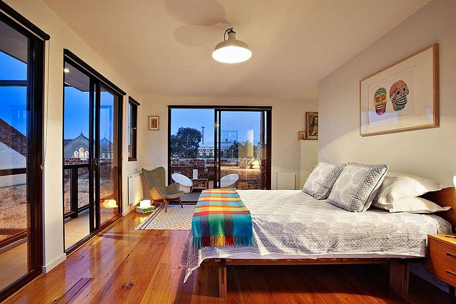 Gorgeous bedroom of the loft-style home with views of the city skyline