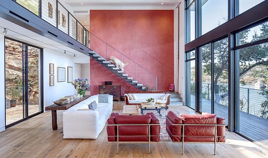 Gorgeous red accent wall for the large, open living room with Lake Austin views