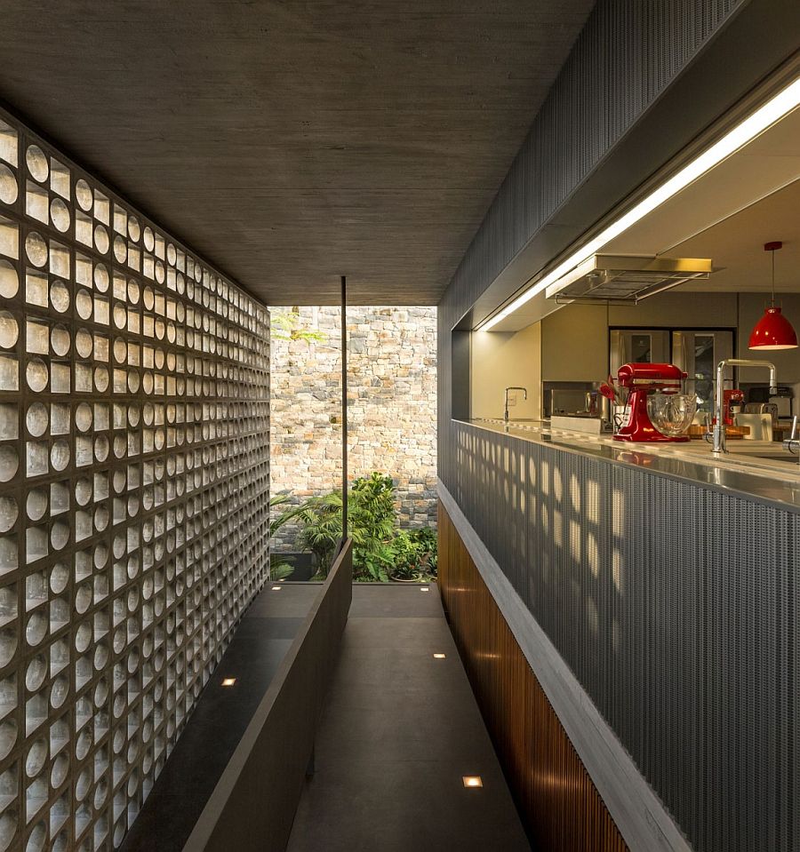 Hollowed-out concrete elements allows light to filter through into the kitchen