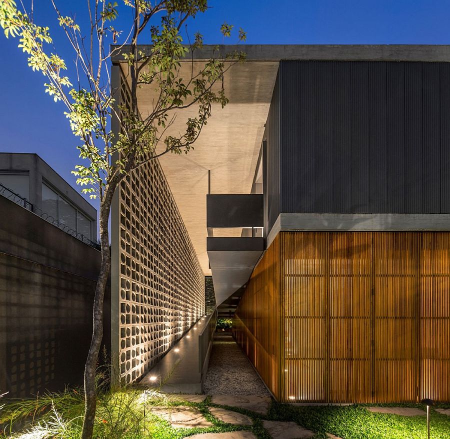 Illuminated ramp leads to the entry of the lavish private home