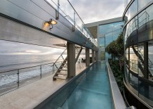Lap-pool-and-walk-way-along-with-an-outdoor-lounge-next-to-the-ocean-217x155