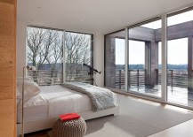 Large-sliding-doors-and-windows-open-the-master-bedroom-towards-the-view-outside-217x155