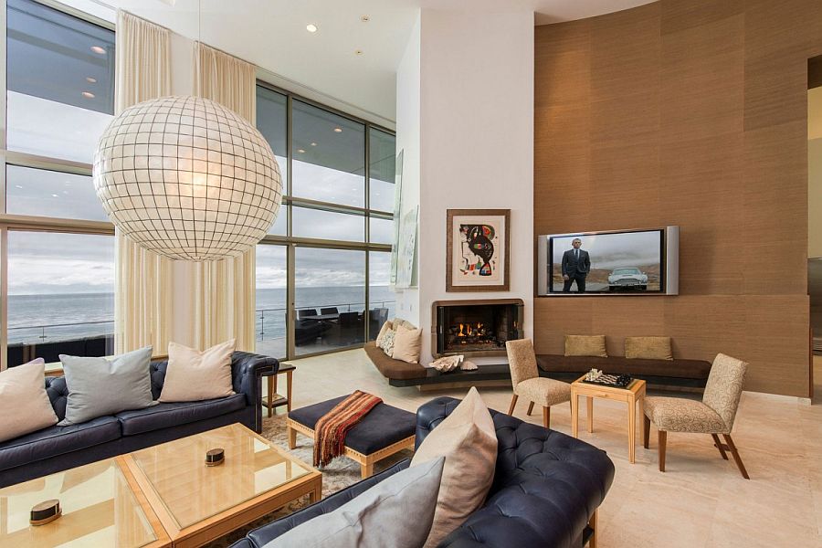 Large windows open up the living area to the ocean outside