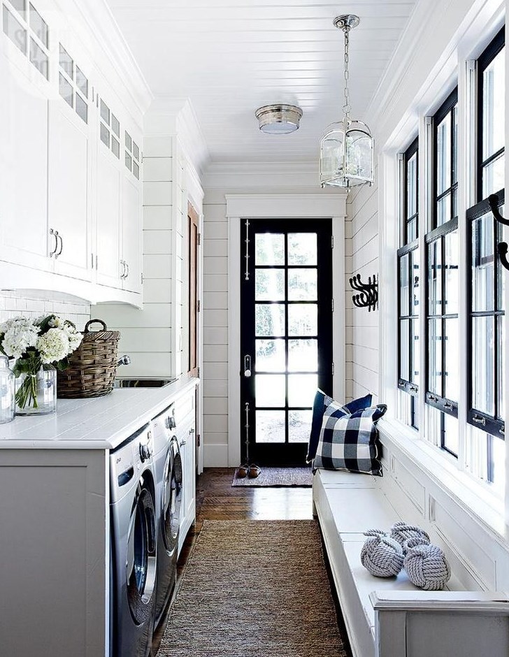 Laundry room with black door and window trim