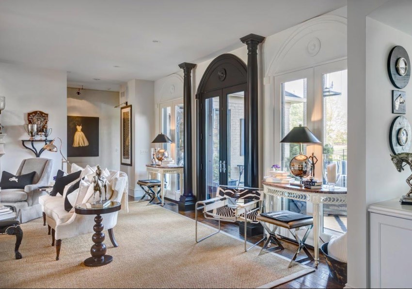 Living room with black door frame and columns