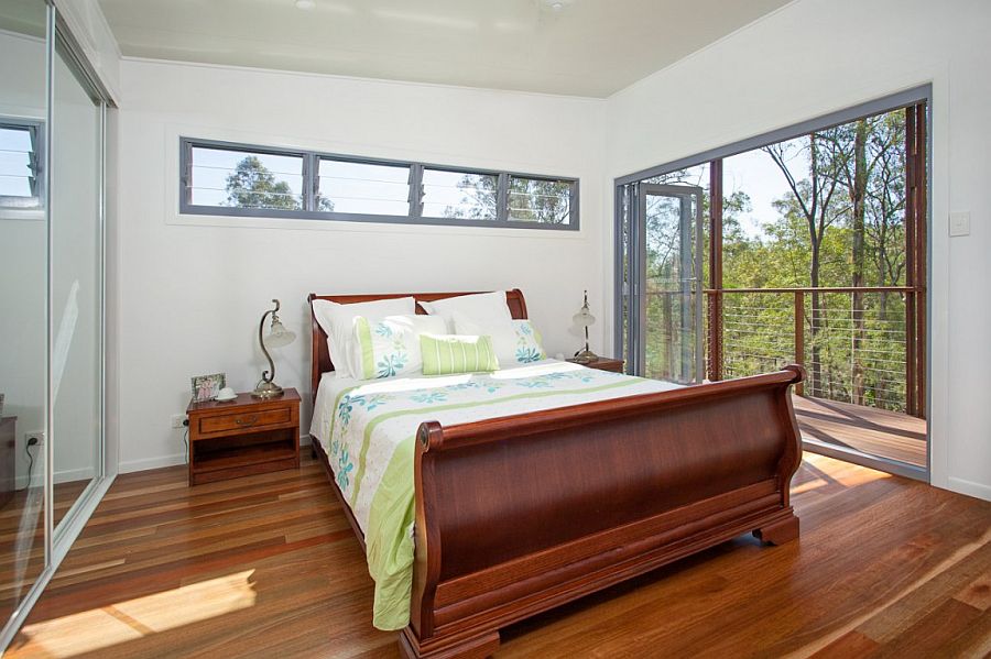 Mirrored wardrobe doors visually extend the space inside the bedroom