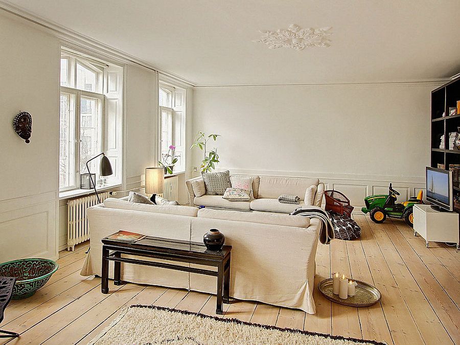 Neutral decor blends in with the backdrop of the chic living room