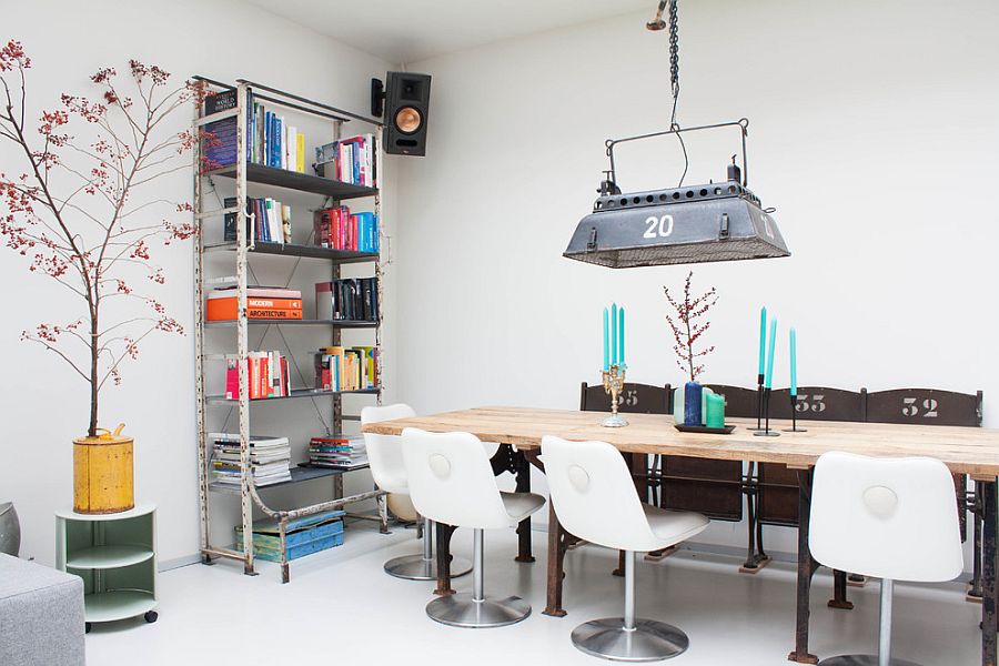 Old theater light transformed into a snazzy pendant in this dining space