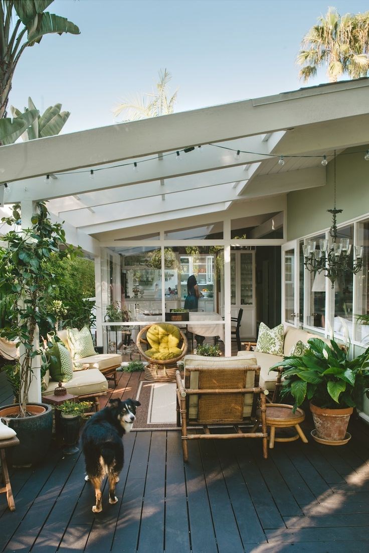 Outdoor lounge area with potted plants