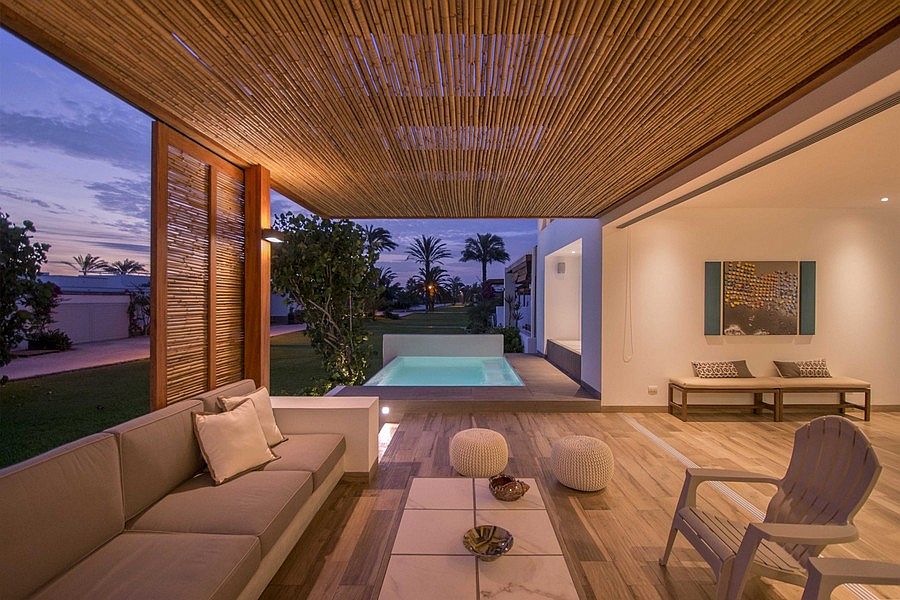 Outdoor lounge of the home offers an unabated view of the distant sea