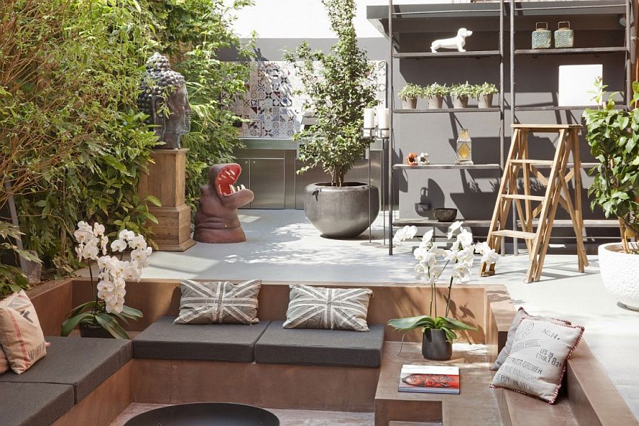 Outdoor sunken lounge surrounded by natural greenery and vintage decor